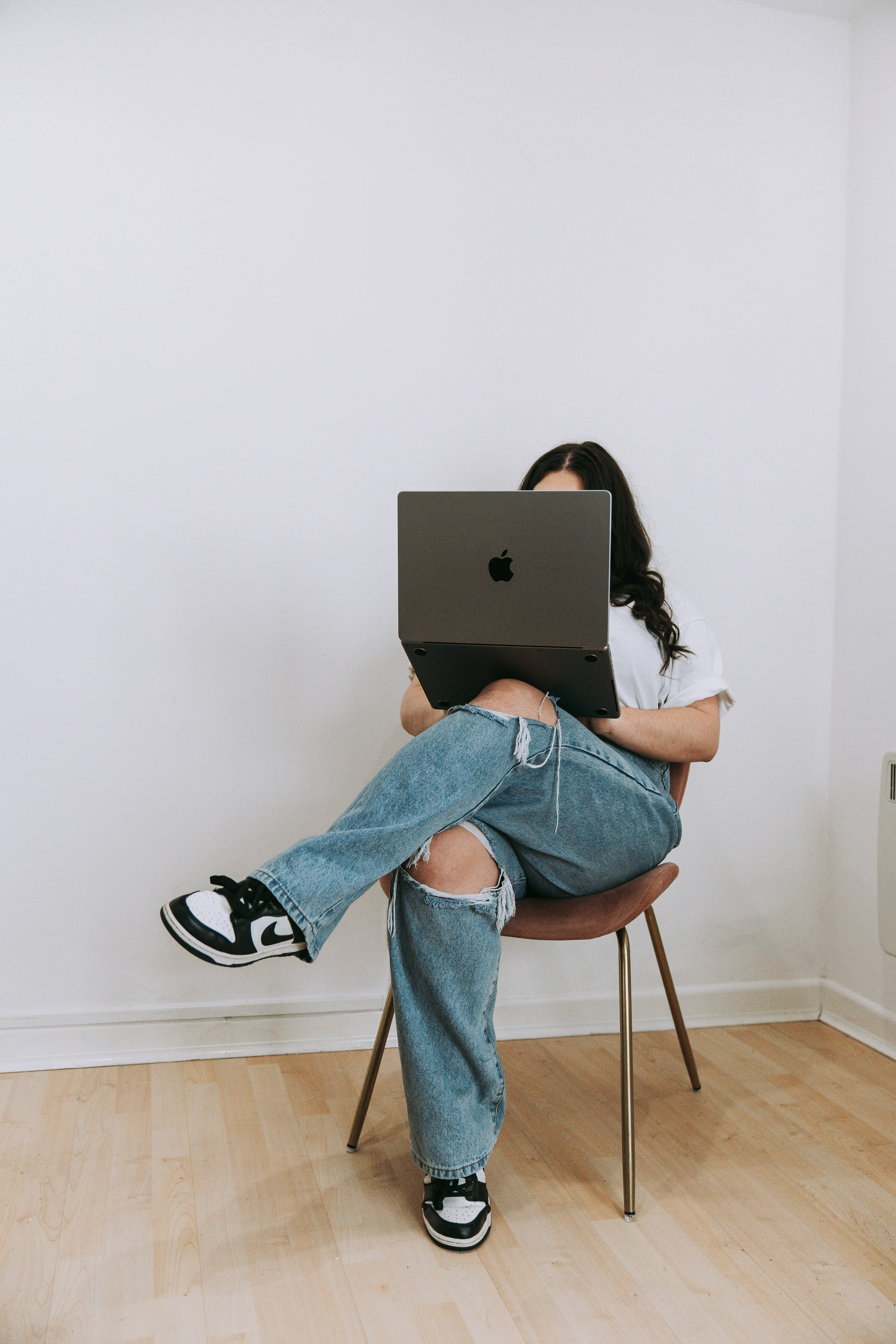 Jade writing at her laptop